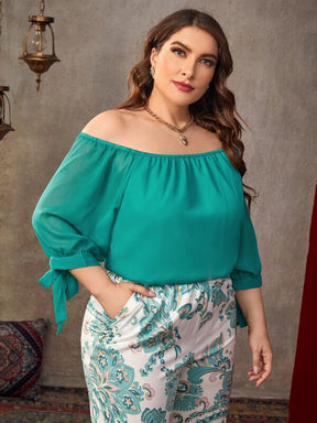 Conjunto Plus Size Top Solto com Decote Amplo em Cor Sólida e Calças Estampadas Espaçosas